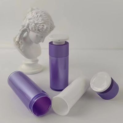 Bottiglia per distributori cosmetici di plastica viola con pompa di pressione bianca