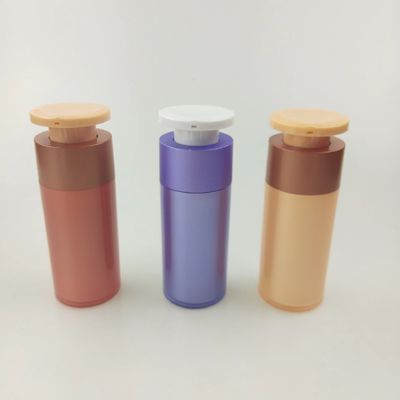 Bottiglia per distributori cosmetici di plastica viola con pompa di pressione bianca