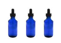 Bottiglie di olio essenziale vuote blu che immagazzinano i prodotti chimici di chimica dei profumi